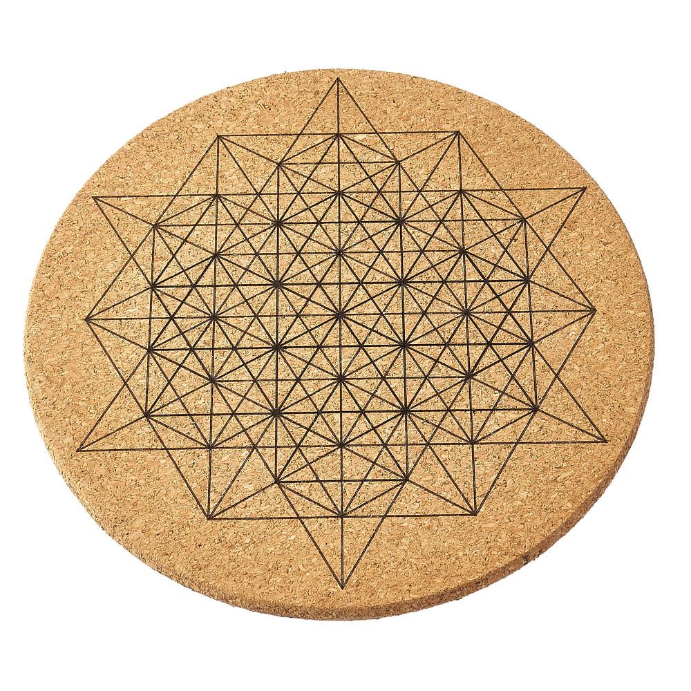 Round cork crystal grid with geometric star pattern on a white background