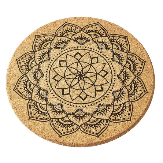 Round cork crystal grid with black mandala design on a white background