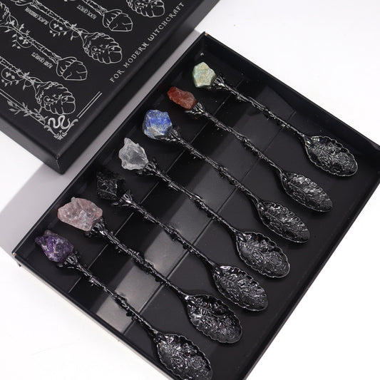 Set of decorative spoons with crystals in a black box