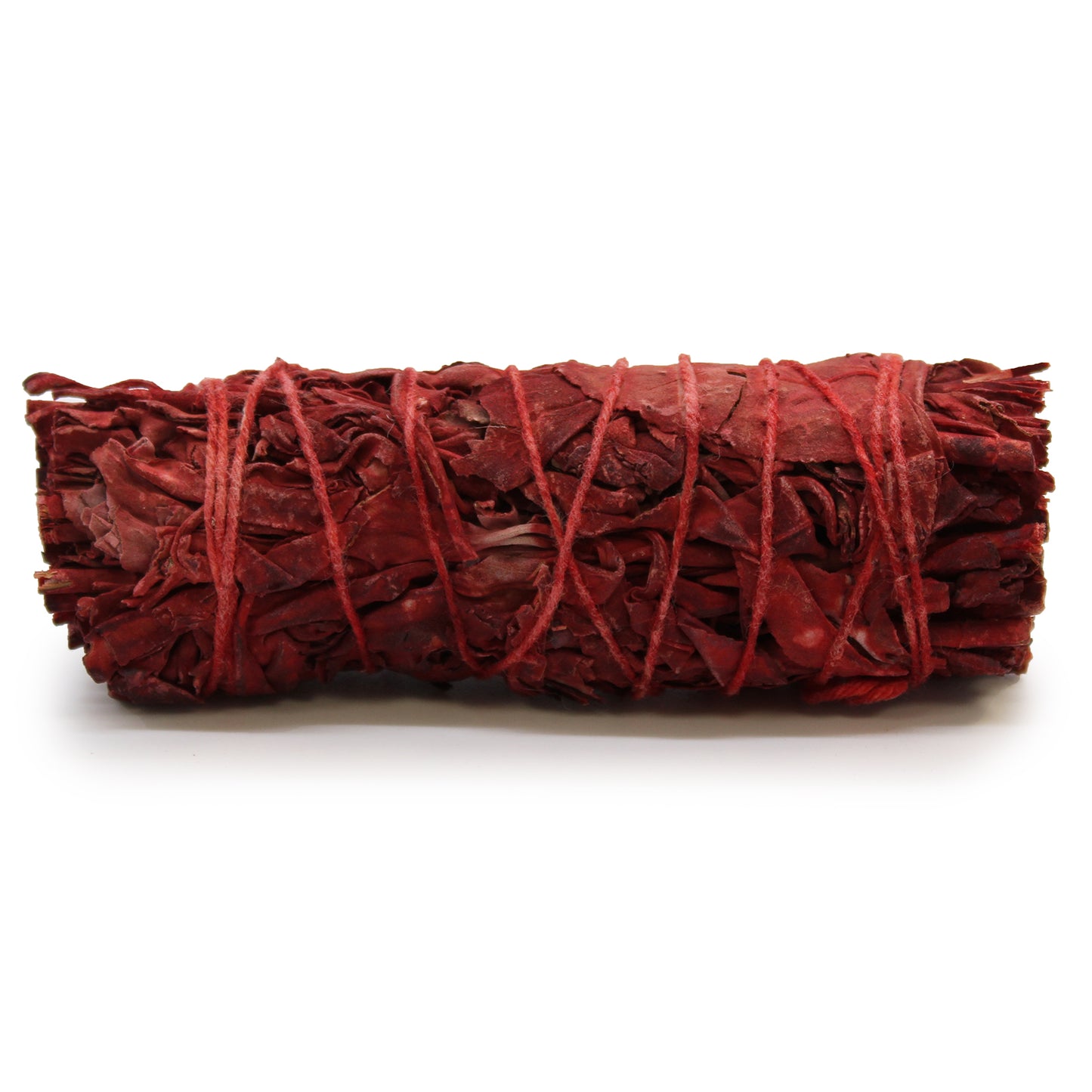 Red dragons blood bundle tied with red string on a white background