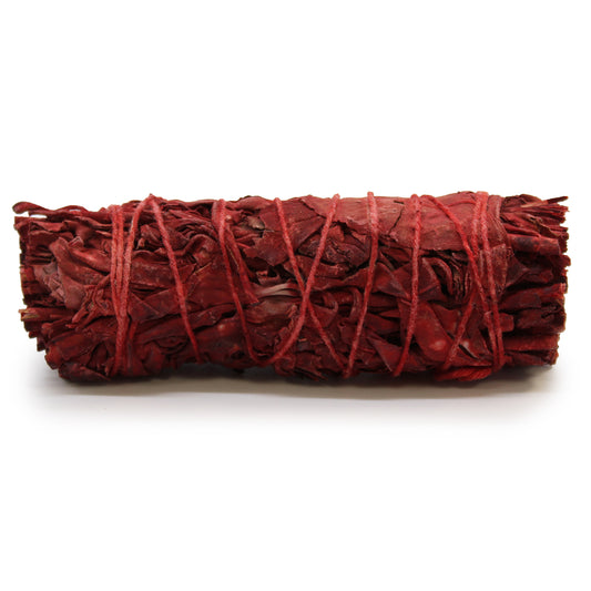 Red dragons blood bundle tied with red string on a white background